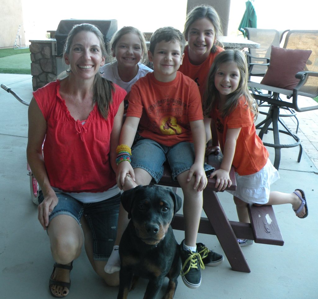 Family with dog being trained from doggie steps by mark siebel in gilbert AZ